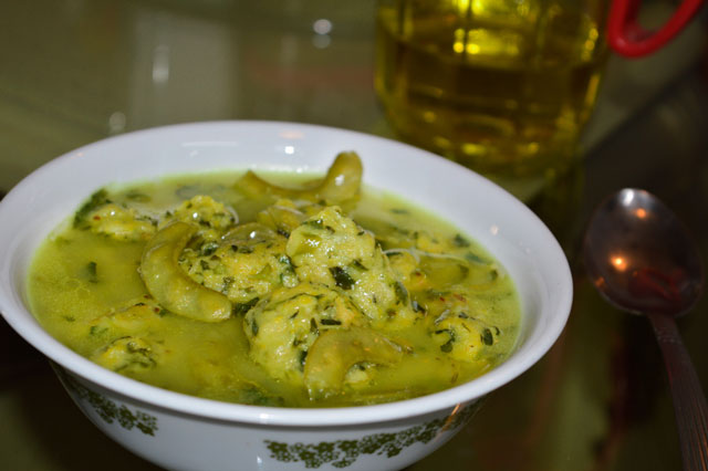 Papdi ma Muthia Recipe- Spinach Fenugreek dumplings in flat green bean sauce.